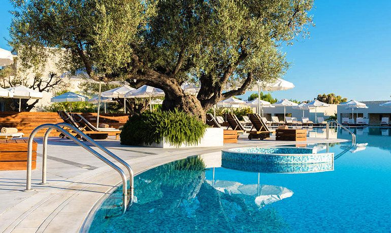 Sentido Port Royal Villas & Spa main pool with sunbeds
