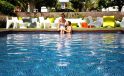 Magnolia Hotel couple in pool